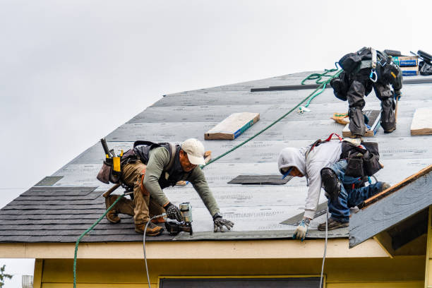Professional Roofing technician working in West Warwick, RI